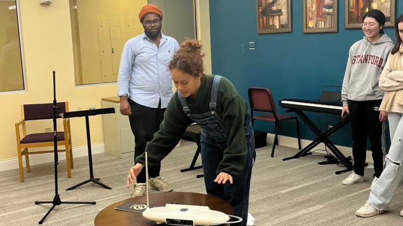 Armond Dorsey, TA for Prof. Ash Fure's Machine Music Class, showing undergraduates how a theremin works.
